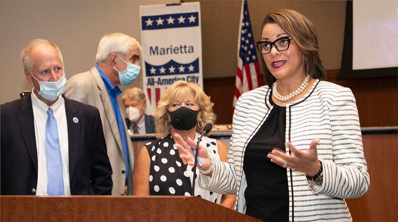 Marietta City Councilwoman Michelle Cooper Kelly (far right) was named the 2020 Woman of the Year by liveSAFE Resources. Councilman Johnny Walker, (left) Mayor Steve "Thunder" Tumlin and Kim Gresh look on.