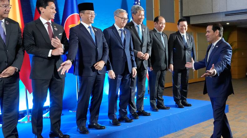 U.S. Secretary of State Marco Rubio, right, arrives for a group photo session during the ASEAN Post Ministerial Conference with the United States on the sidelines of the Association of Southeast Asian Nations (ASEAN) Foreign Ministers' Meeting in Pasay city, Metro Manila, Philippines Wednesday, July 22, 2026. (AP Photo/Aaron Favila, Pool)