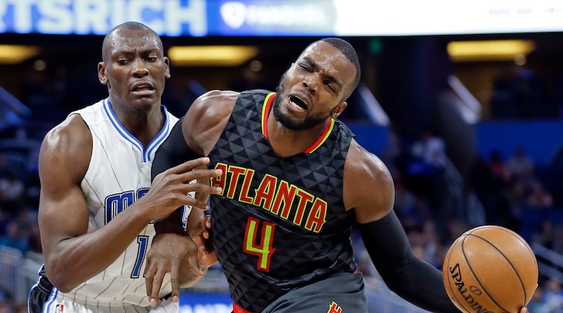 Atlanta Hawks’ Paul Millsap (4) is fouled by Orlando Magic’s Bismack Biyombo while driving to the basket during the second half of an NBA basketball game, Wednesday, Jan. 4, 2017, in Orlando, Fla. Atlanta won 111-92. (AP Photo/John Raoux)