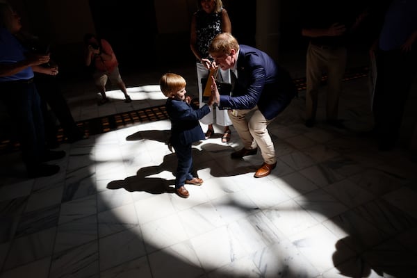 State Sen. Blake Tillery, R-Vidalia, high-fives one of his sons after the press conference where he announced his kickoff campaign for lieutenant governor on Monday, Aug. 11, 2025. (Miguel Martinez/AJC)