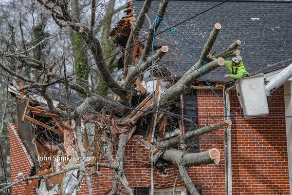Strong winds on Wednesday afternoon brought down a tree on an apartment building at The Columns at East Hill in Decatur.
