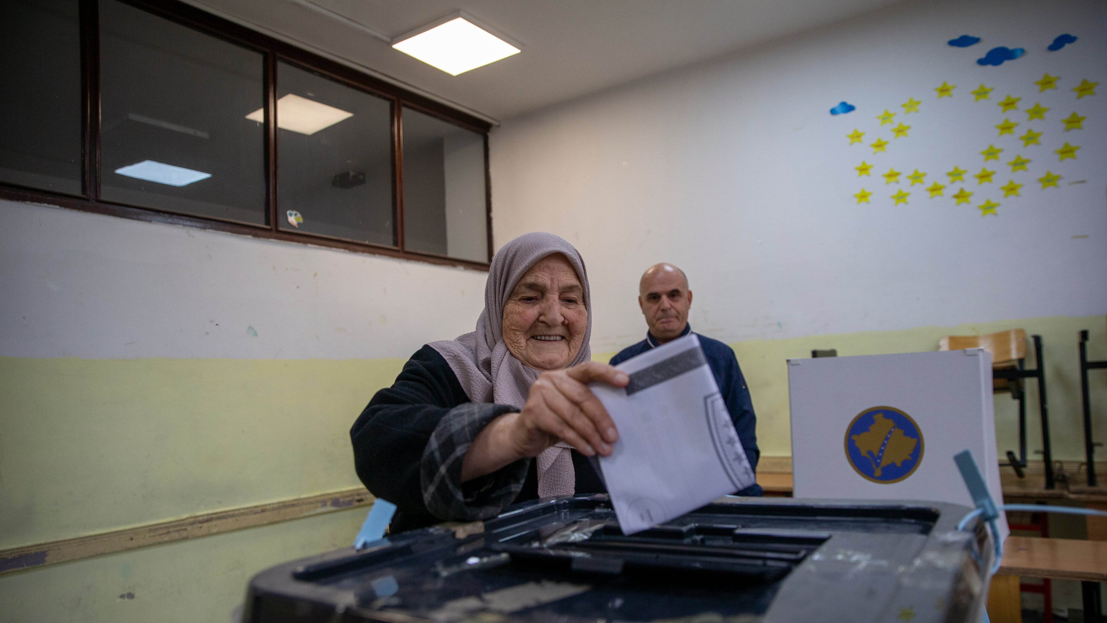 Voters cast their ballot for the municipal elections in Pristina, Kosovo on Sunday, Oct. 12, 2025. (AP Photo/Visar Kryeziu)
