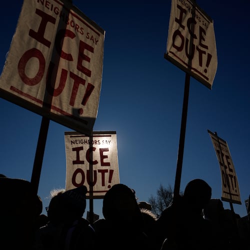 Protesters gather in front of the Minnesota State Capitol in response to the death of Renee Good, who was fatally shot by an ICE officer last week, Wednesday, Jan. 14, 2026, in St. Paul, Minn. (AP Photo/John Locher)