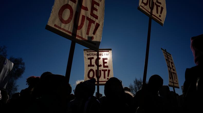 Protesters gather in front of the Minnesota State Capitol in response to the death of Renee Good, who was fatally shot by an ICE officer last week, Wednesday, Jan. 14, 2026, in St. Paul, Minn. (AP Photo/John Locher)