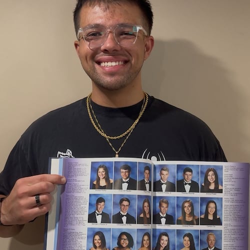 This photo provided by Evan Pfeufer shows Pfeufer pointing to his senior quote in his high school yearbook, which reads: "Knicks in 6. 2026 NBA Finals" on Thursday, June 4, 2026, in Kings Park, N.Y. (Evan Pfeufer via AP)