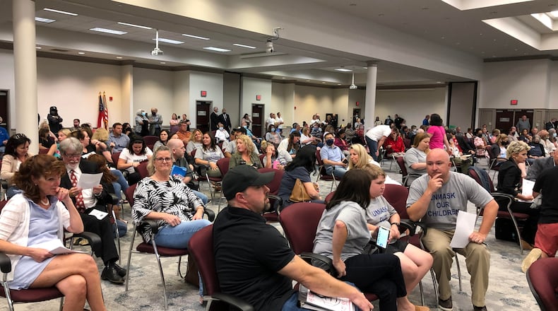 Scores of audience members refused to wear masks or leave the Gwinnett County Board of Education meeting Thursday, May 20, 2021.