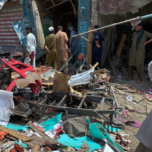 Local residents examine damage at the site of a bomb explosion at a market in Sarai Norag in Lakki Marwat, a district in Pakistan's Khyber Pakhtunkhwa province, Tuesday, May 12, 2026. (AP Photo/Farhat Ullah)