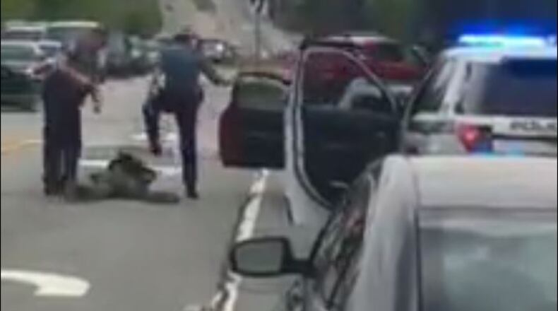 A video posted on social media Wednesday appears to show a Gwinnett County police officer kicking a man in the head as he lies on the ground during a traffic stop.