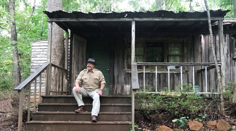 Colin Cary is the Atlanta Movie Tour guide who will lead the “Upside Down” tour focused on locations shot for the Netflix show “Stranger Things.” Here he is dressed as Jim Hopper in front of the fictional character’s trailer in Powder Springs. CREDIT: Rodney Ho/rho@ajc.com