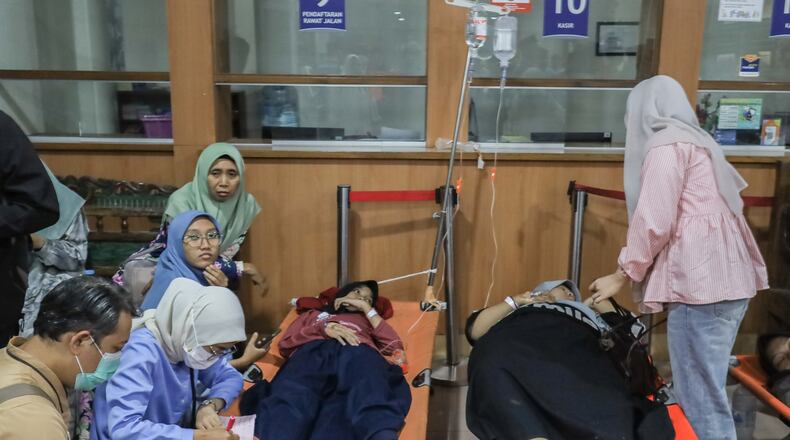 Students who fell ill allegedly due to food poisoning after consuming free meals at their school receive medical treatment at a hospital in Sidoarjo, East Java, Indonesia, Wednesday, Sept. 2, 2026. (AP Photo/Jusuf Aydin)
