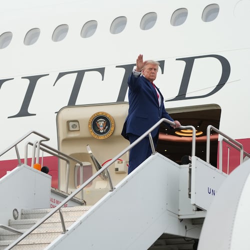 President Donald Trump boards Air Force One at Cleveland Hopkins International Airport in Cleveland, Tuesday, Aug. 11, 2026. (AP Photo/Mark Schiefelbein)