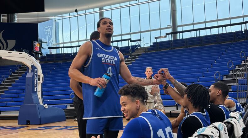 Georgia State's Cesare Edwards (standing)  and his teammates take a break from their scrimmage toward the end of practice on March 3, 2025, at the GSU Convocation Center.
