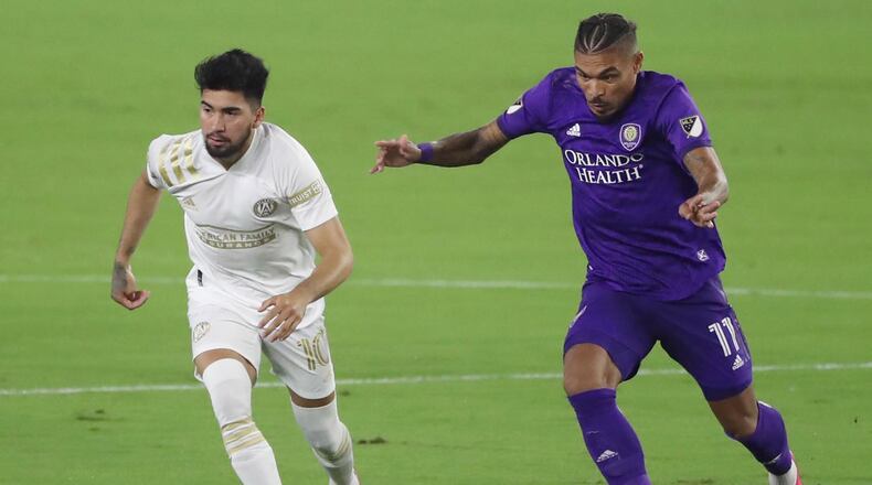 Atlanta United's Mearcelino Moreno (10) and Orlando City's Junior Urso (11) compete at Exploria Stadium in Orlando, Florida, on Wednesday, Oct. 28, 2020. (Stephen M. Dowell/Orlando Sentinel/TNS)