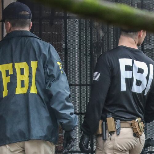 FBI agents work the scene of a search in this 2023 file photo. FBI agents have been directed to de-emphasize investigating white-collar crime, fraud and corruption in favor of assisting with transporting immigrants for ICE. (John Spink/AJC)