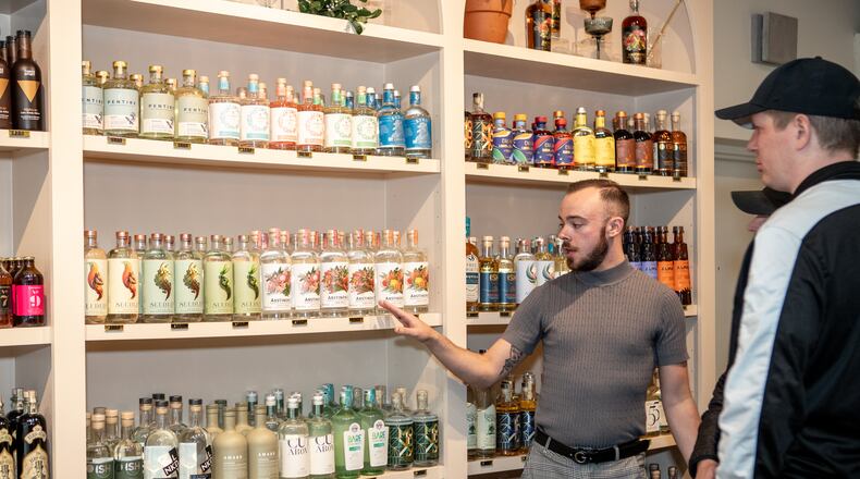 Jared Lance Kerschner explains the different non-alcoholic available for purchase at Soberish in Kirkwood. (Jenni Girtman for The Atlanta Journal-Constitution)