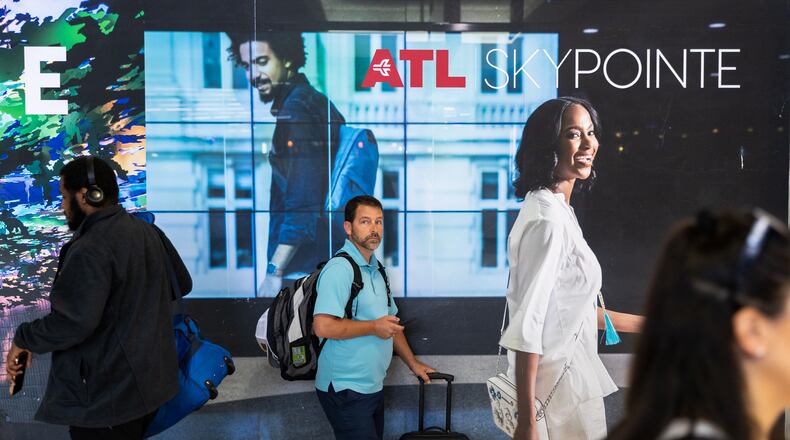 Travelers are seen in the domestic terminal of Hartsfield-Jackson airport in Atlanta on Friday, June 30, 2023. (Arvin Temkar / arvin.temkar@ajc.com)