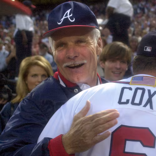 Longtime Braves owner Ted Turner (back) congratulates manager Bobby Cox on a win in the 2001 National League Division Series. (Marlene Karas/AJC 2001)