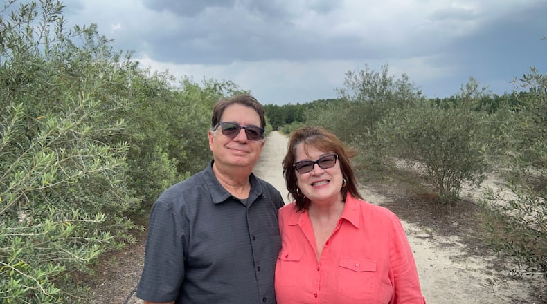 Curtis (left) and Tracy Poling established Woodpecker Trail Olive Farm in 2014. Courtesy of Woodpecker Trail Olive Farm