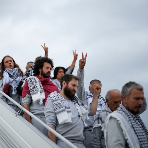 Activists from the Global Sumud Flotilla disembark a plane upon arriving at Istanbul Airport, in Istanbul, Turkey, Thursday, May 21, 2026. (AP Photo/Emrah Gurel)