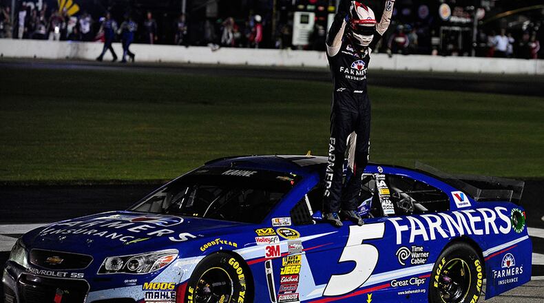 Kasey Kahne, driver of the No. 5 Farmers Insurance Chevrolet, celebrates after winning the NASCAR Sprint Cup Series Oral-B USA 500 at Atlanta Motor Speedway Sunday in Hampton, Ga.