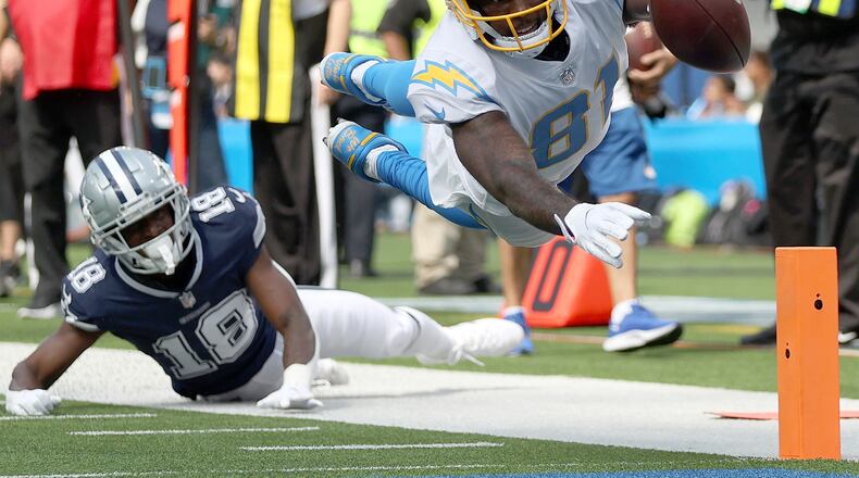 Mike Williams (81) of the Los Angeles Chargers dives for a touchdown against Damontae Kazee (18) of the Dallas Cowboys at SoFi Stadium on September 19, 2021 in Inglewood, California. (Ronald Martinez/Getty Images/TNS)
