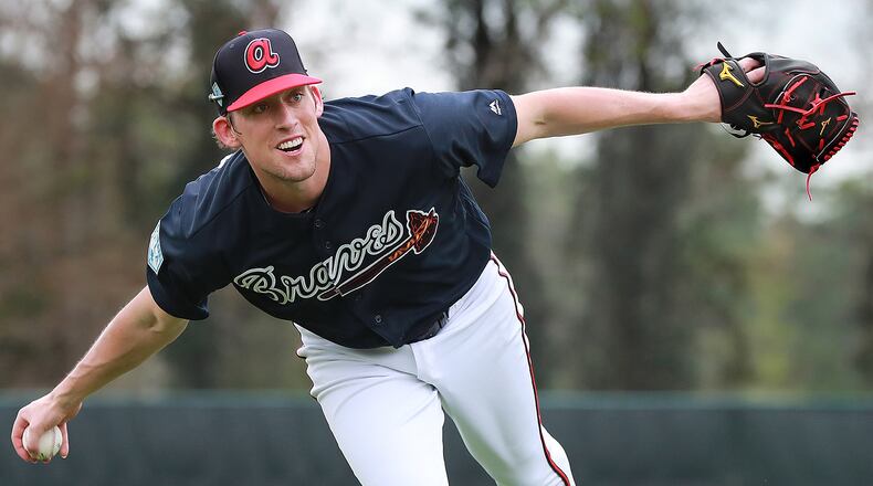 Atlanta Braves pitcher Dan Winkler fields a ground ball and makes the play to home during spring training Monday, Feb. 18, 2019, at the ESPN Wide World of Sports Complex in Lake Buena Vista, Fla.