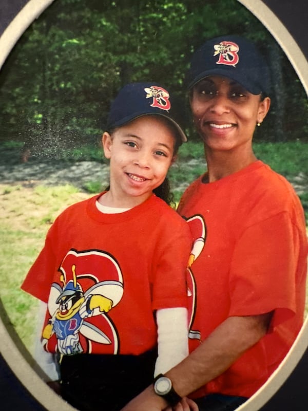 Janene and Elana Edusei posing in a softball team photo back in 2005. (Janene Edusei/Courtesy)
