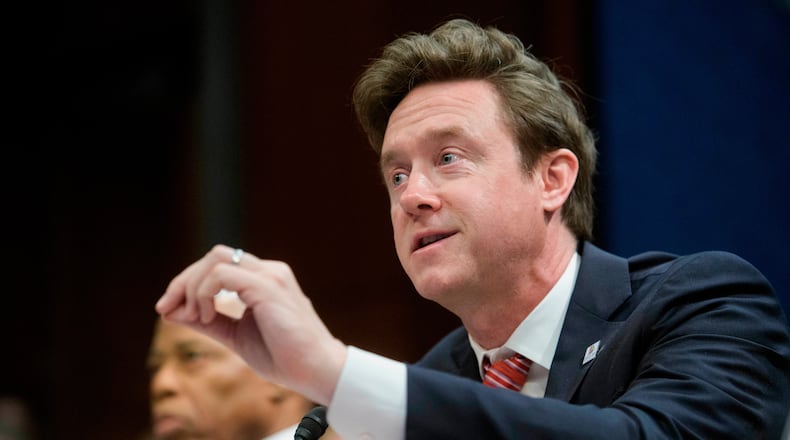 FILE - Denver Mayor Mike Johnston responds to questions during a House Committee on Oversight and Government Reform hearing with Sanctuary City Mayors on Capitol Hill, March 5, 2025, in Washington. (AP Photo/Rod Lamkey, Jr., File)
