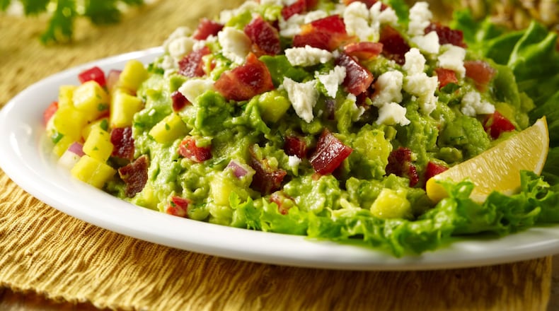 Uncle Julio’s bacon-pineapple guacamole is served at the restaurant chain’s Boca Raton location. (Contributed by Uncle Julio’s)