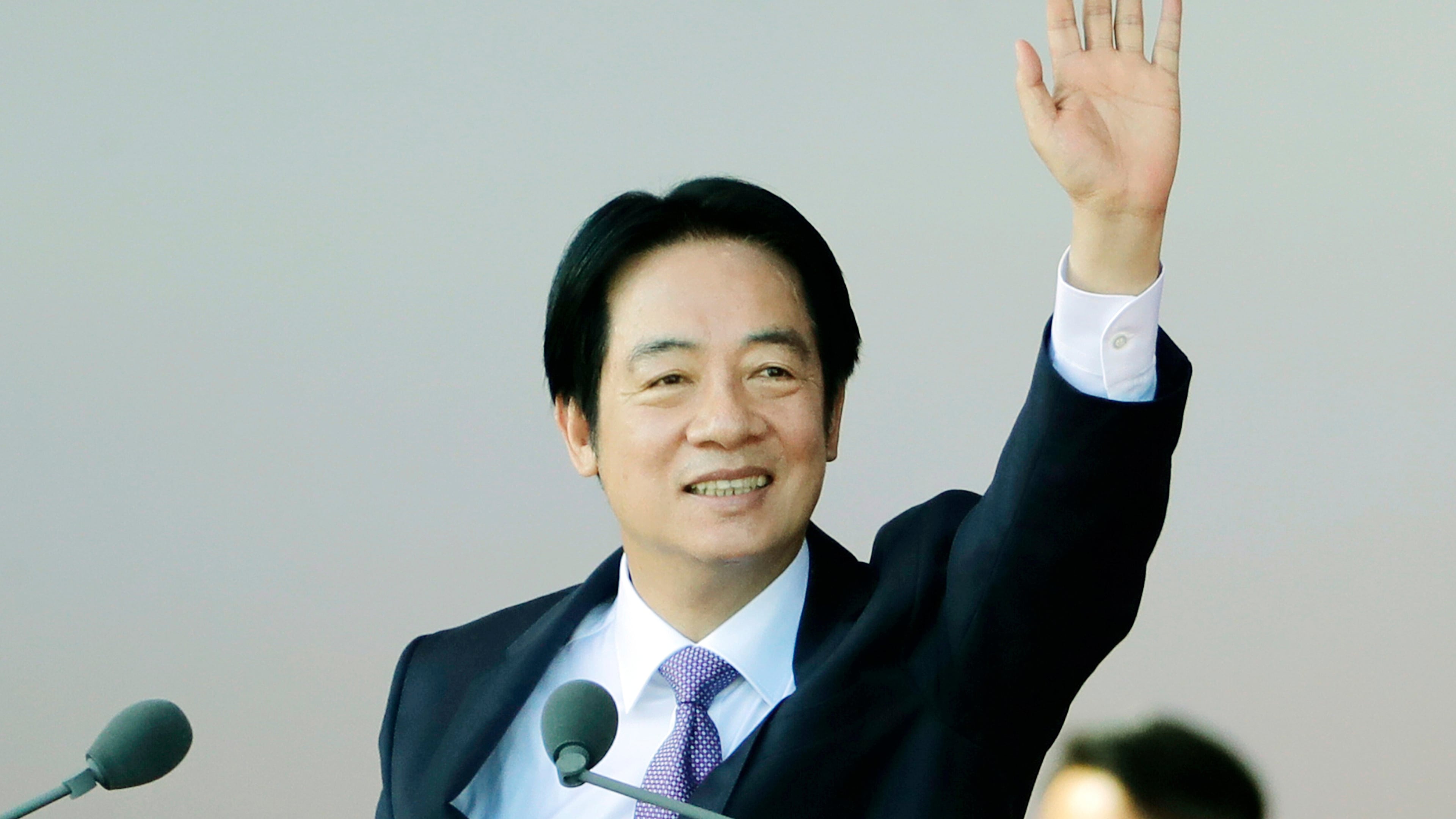 Taiwanese President Lai Ching-te waves during National Day celebrations in front of the Presidential Building in Taipei, Taiwan, Friday, Oct. 10, 2025. (AP Photo/Chiang Ying-ying)