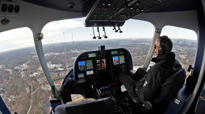 Pilot Jeff Capek pilots the blimp on a short flight around Atlanta. The Goodyear Blimp was in town operating out of Peachtree Dekalb Airport today. The Chick-fil-A College Football Hall of Fame in introducing an exhibit on the Goodyear Blimp's nearly 65-year history in college football. The Goodyear Blimp was honorarily inducted into the College Football Hall of Fame this year as the first non-player or coach to receive the honor. Bob Andres / bandres@ajc.com