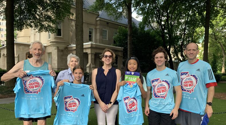 Jere Allen (left) and wife Faye Allen with son Bill (right), daughter-in-law Lisa (center) and their three children after the 2022 AJC Peachtree Road Race.
(Courtesy of Bill Allen)