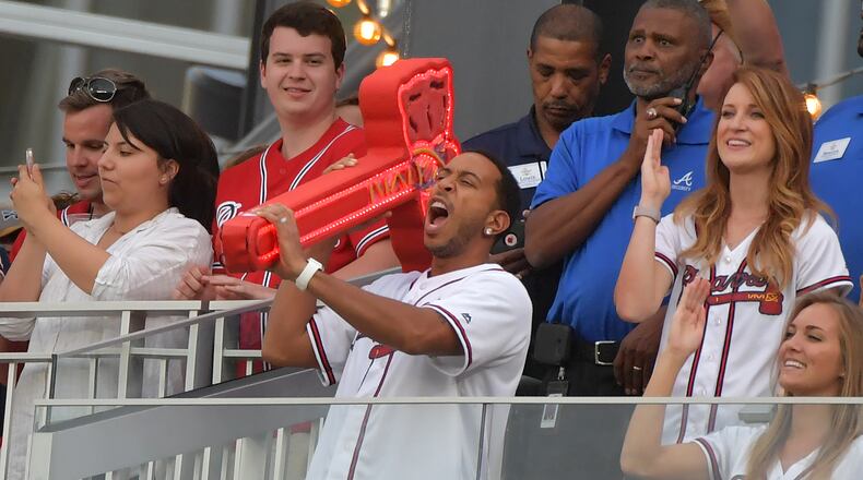 April 15, 2017 Atlanta - Ludacris leads the first chop from the Chop House during Atlanta Braves baseball game against the San Diego Padres at SunTrust Park on Saturday, April 15, 2017. HYOSUB SHIN / HSHIN@AJC.COM