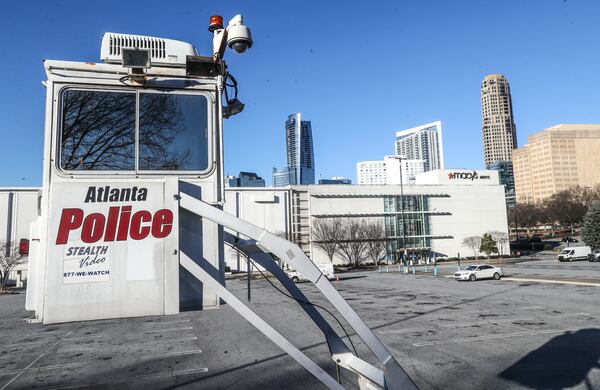 February 10, 2022 Atlanta: A police surveillance tower overlooks Lenox Square on Thursday, Feb. 10,2022. Continuing a string of violent incidents at Lenox Square, a man who had just bought a new pair of pricey Nike Air Jordan 1 sneakers recently became the latest victim of violent crime on the luxury mall’s property.  (John Spink / John.Spink@ajc.com)


