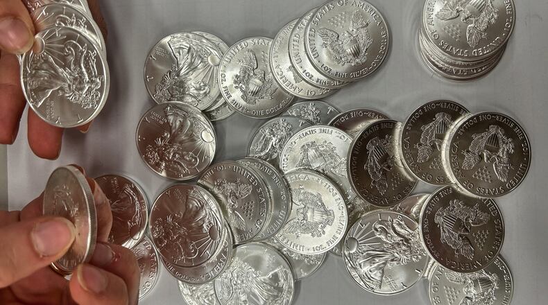This handout photo released by Norwegian economic crime investigators on Thursday, Sept. 17, 2026, shows the U.S. "American Eagle" silver coins discovered by police in a van that was stopped after being driven "erratically" outside Oslo in April 2025. (Norwegian economic crime investigators via AP)
