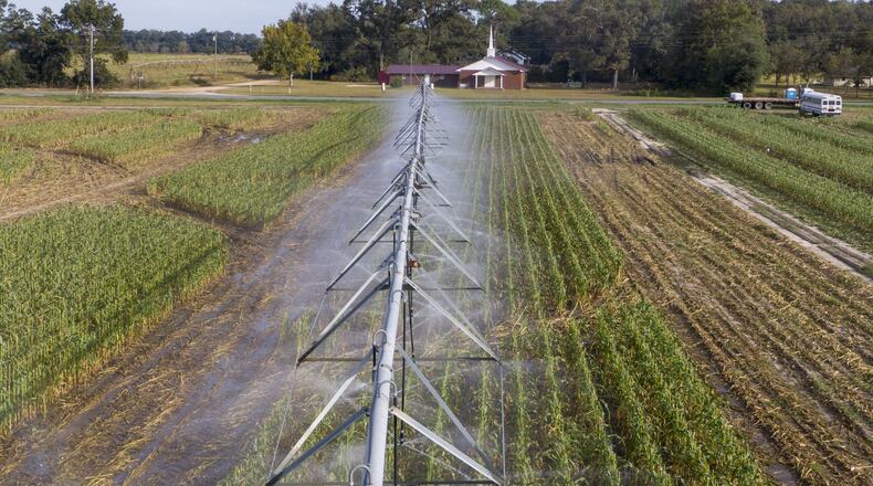 An irrigation sprinkler system waters crops at Worsham Farms near Vada on Oct. 17, 2019. (Hyosub Shin / Hyosub.Shin@ajc.com)