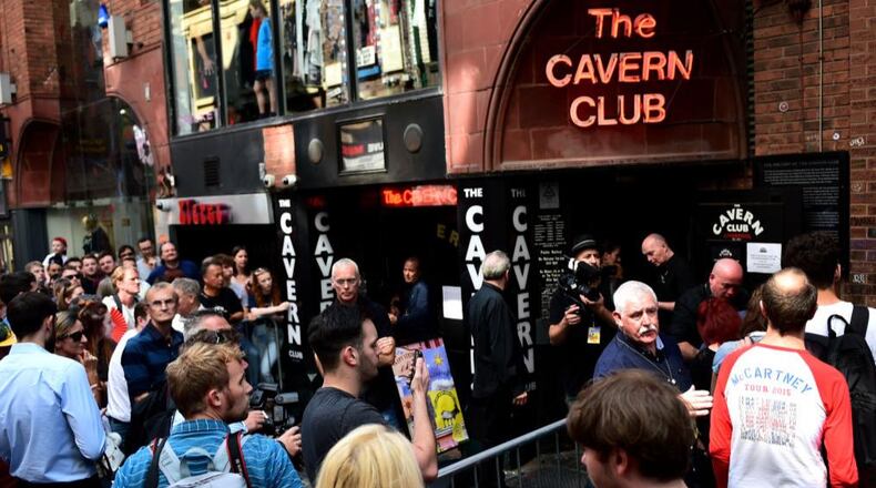 Fans of Paul McCartney make their way inside The Cavern Club in Liverpool on Thursday afternoon.