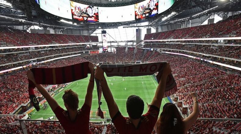 September 16, 2017 Atlanta United fans cheer for their team before an MLS soccer match against the Orlando City SC on Saturday, September 16, 2017. Saturday's Atlanta United match against Orlando City will be the third at Mercedes-Benz for the first-year franchise, and a Major League Soccer single-game attendance record is expected to be set in the latest meeting of the southern MLS rivals. HYOSUB SHIN / HSHIN@AJC.COM