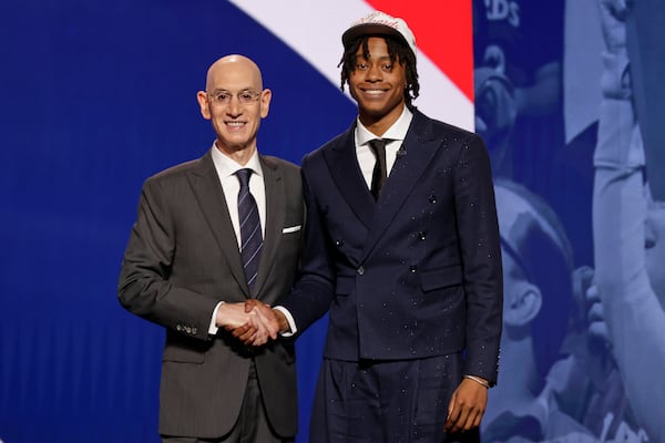Trę Johnson poses for a photo with NBA commissioner Adam Silver after being selected sixth by the Washington Wizards in the first round of the NBA basketball draft, Wednesday, June 25, 2025, in New York. (AP Photo/Adam Hunger)