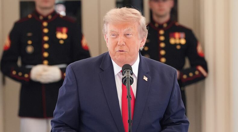 President Donald Trump speaks on West Executive Drive at the White House during a showcase for the upcoming Freedom 250 Grand Prix auto race, Monday, July 13, 2026, in Washington. (AP Photo/Alex Brandon)