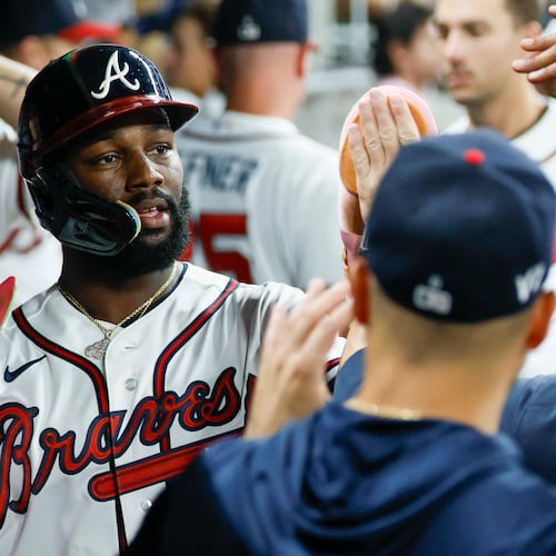 Atlanta Braves center fielder Michael Harris II (23) celebrates in the dugout after scoring on a double by Atlanta Braves center fielder Lane Thomas (20) during the sixth inning against the Miami Marlins on Thursday, August 6, 2026, at Truist Park in Atlanta.
(Miguel Martinez/ AJC)