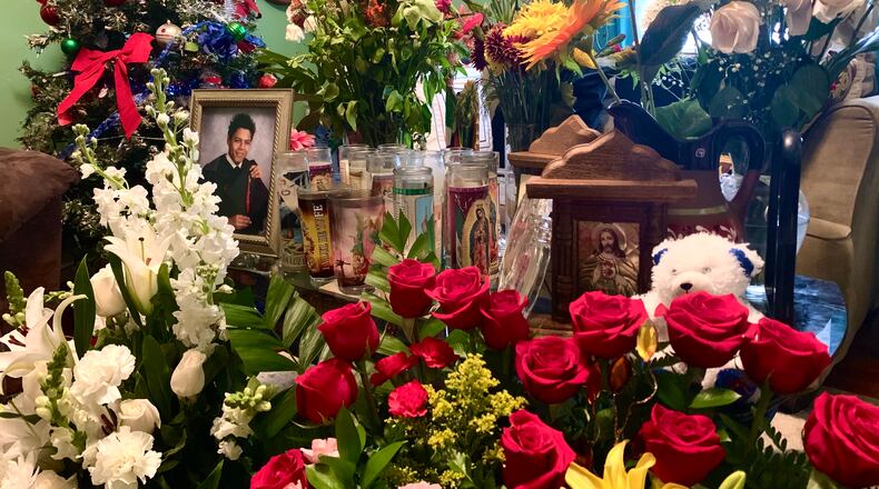 The entry of Yessica Lopez's parents' home has become a memorial of sorts after her husband, Juan Lopez, died Nov. 26.