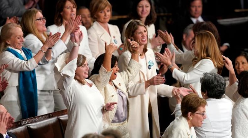 Members of Congress cheer after President Donald Trump acknowledges more women in Congress during his State of the Union address to a joint session of Congress on Capitol Hill in Washington, Tuesday, Feb. 5, 2019.