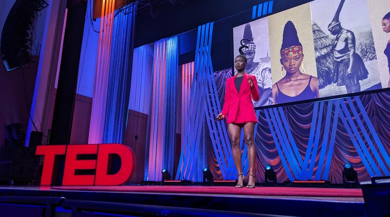 Laetitia Ky, an artist from the Ivory Coast who sculpts her hair, speaks at TEDWomen at the Woodruff Arts Center on Thursday, October 12. Mirtha Donastorg/AJC