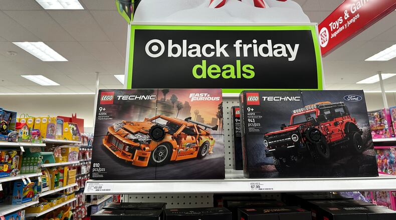 Sign marks special prices on toys as retailers roll out Black Friday deals, Wednesday, Nov. 26, 2025, in a Target store in southeast Denver. (AP Photo/David Zalubowski)