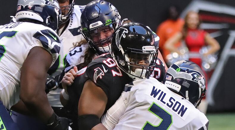 October 27, 2019 Atlanta: Atlanta Falcons defensive tackle Grady Jarrett sacks Seattle Seahawks quarterback Russell Wilson during the third quarter in an NFL football game on Sunday, October 27, 2019, in Atlanta. It had been four games since the Falcons recorded their last sack.   Curtis Compton/ccompton@ajc.com