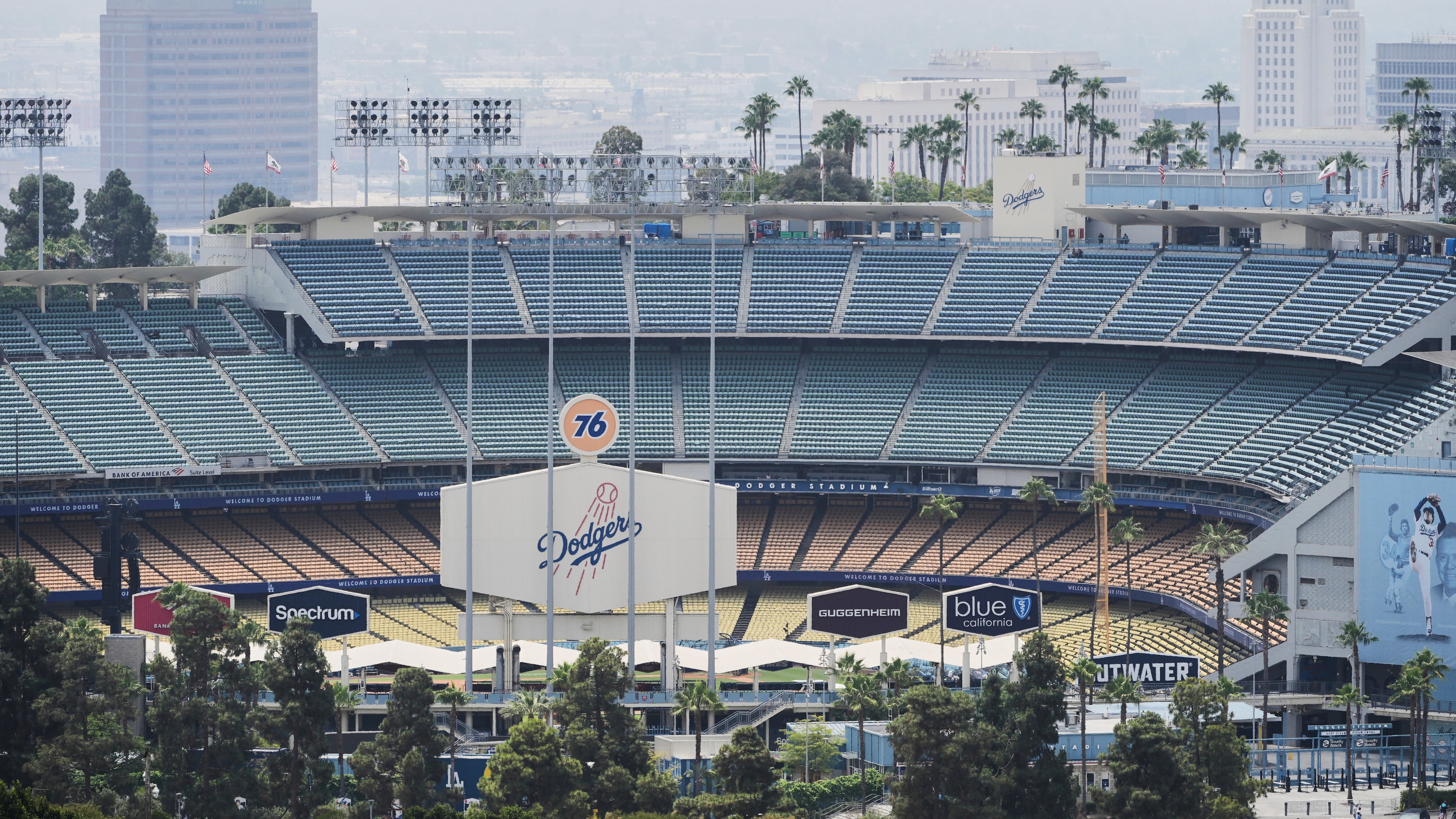 FILE - Dodger Stadium is shown before an evening baseball game, June 20, 2025, in Los Angeles. (AP Photo/Damian Dovarganes, File)