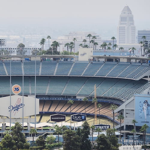 FILE - Dodger Stadium is shown before an evening baseball game, June 20, 2025, in Los Angeles. (AP Photo/Damian Dovarganes, File)
