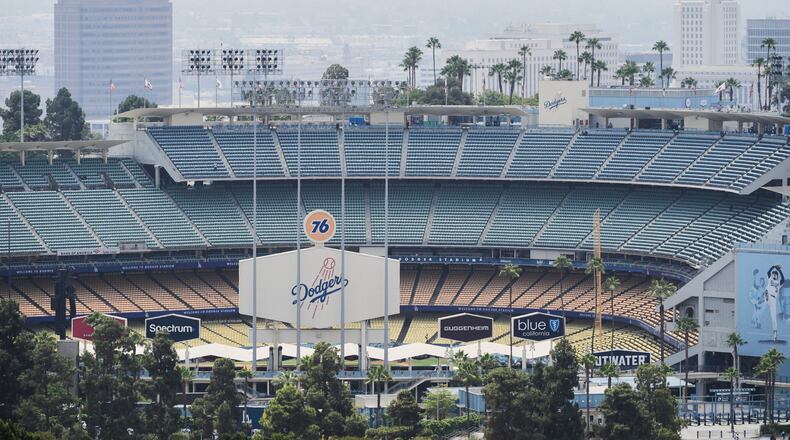 FILE - Dodger Stadium is shown before an evening baseball game, June 20, 2025, in Los Angeles. (AP Photo/Damian Dovarganes, File)