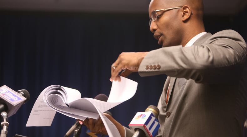 DeKalb DA Robert James reads the charges outlined in the indictment against DeKalb CEO Burrell Ellis at a news conference on June 18, 2013.